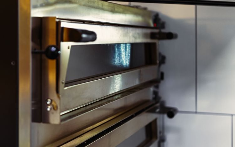 Dual door stainless steel deck oven with the doors in the closed position